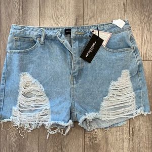 Pretty Little Thing. Light Wash Ripped Jean Shorts